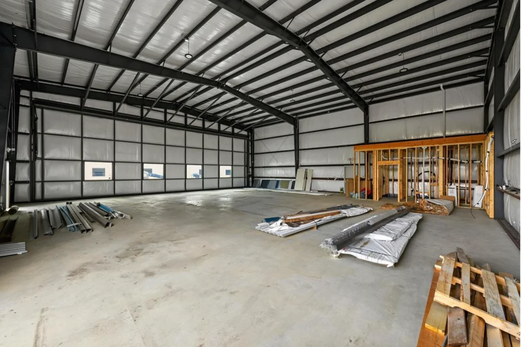 Hangar construction interior with framed utility area