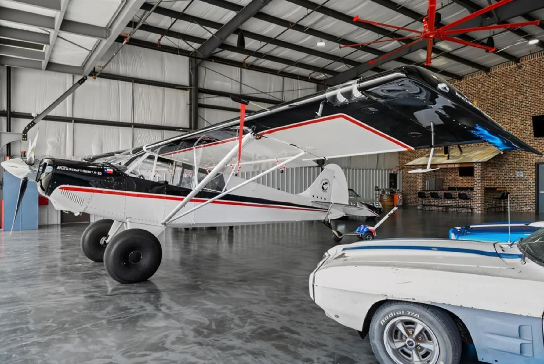 Representative finished hangar with aircraft and collector vehicle